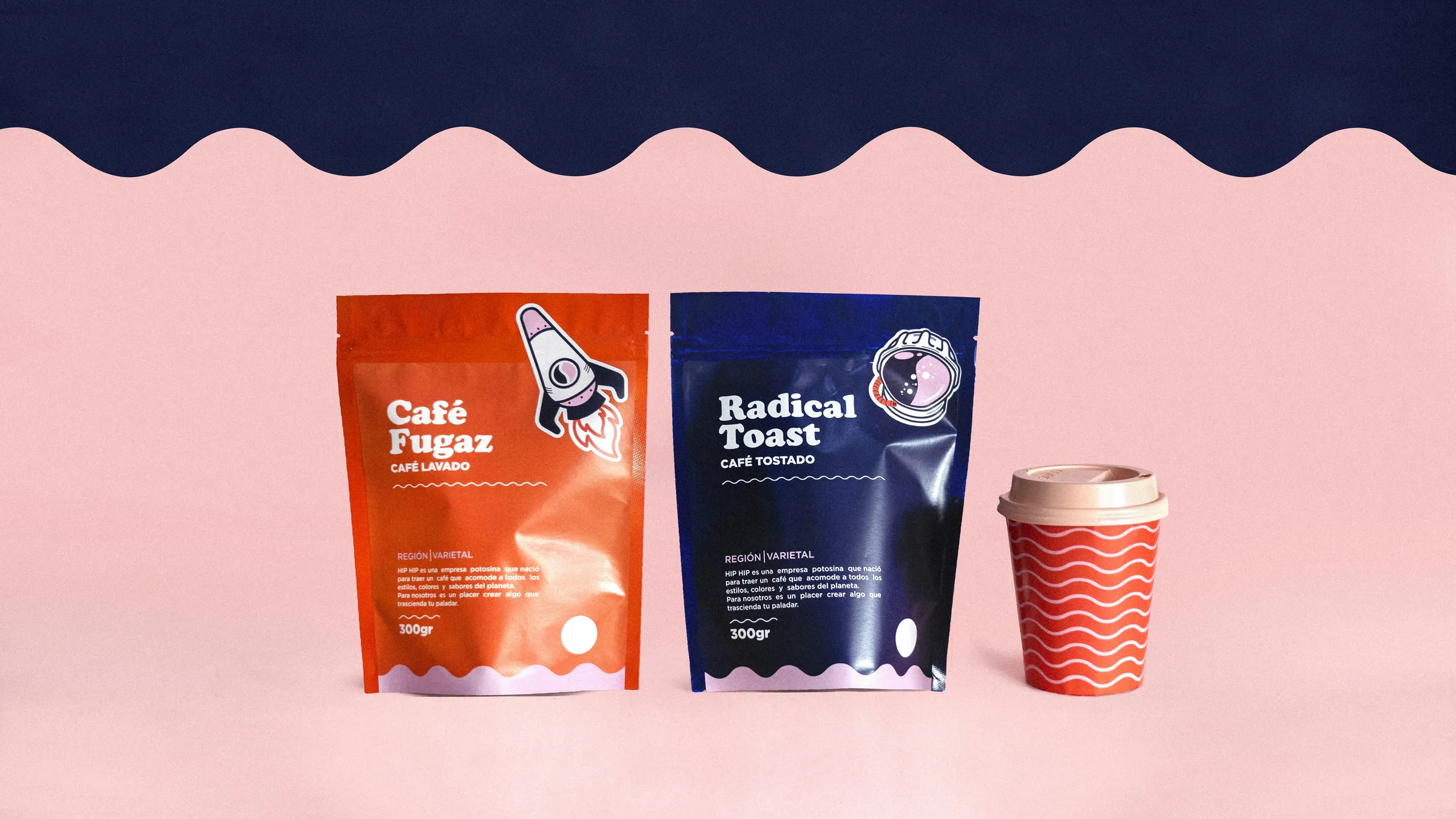 Orange and navy printed coffee pouches with a matching takeaway cup