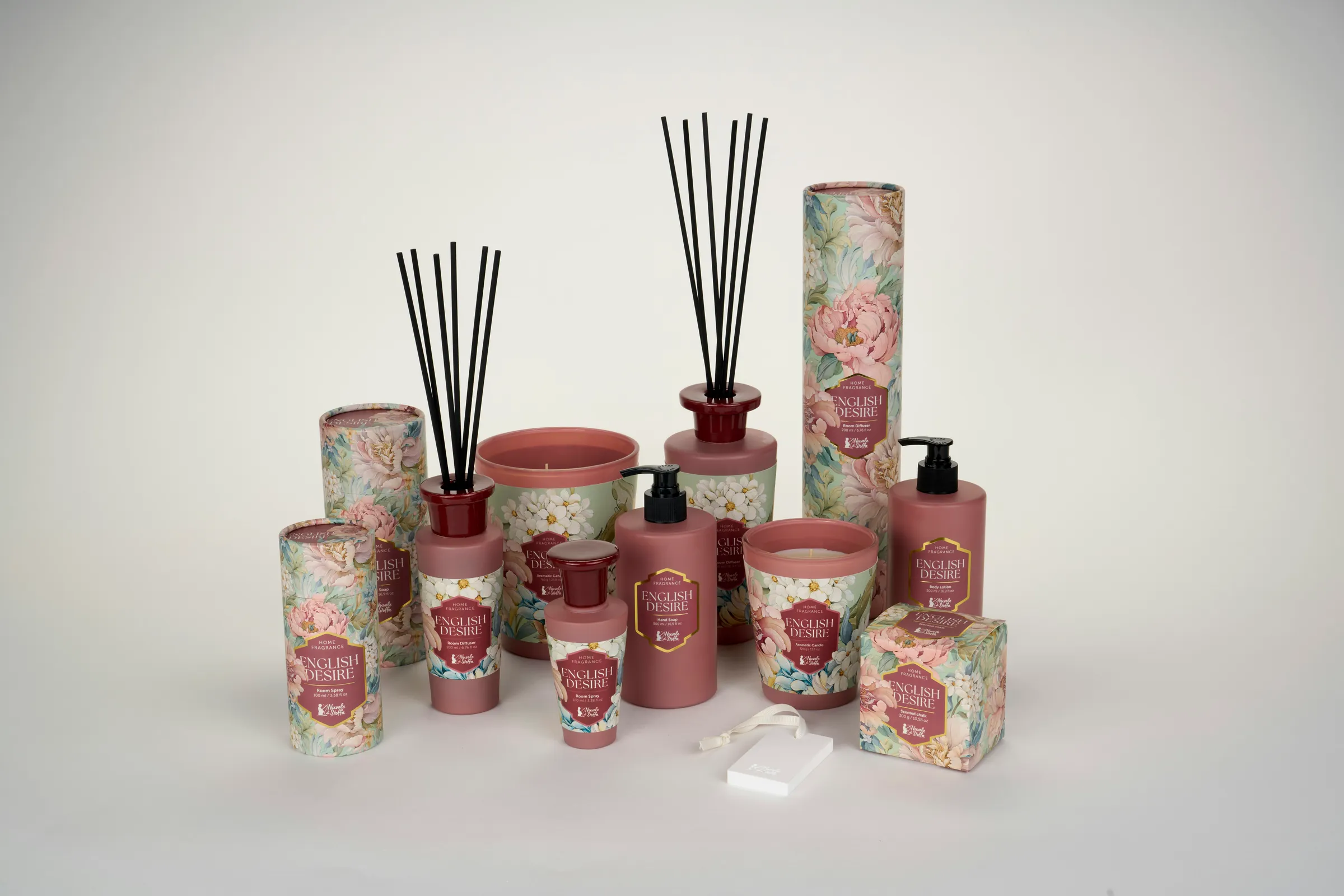 Home fragrance range with floral print: reed diffusers, candles, hand wash and paper tubes