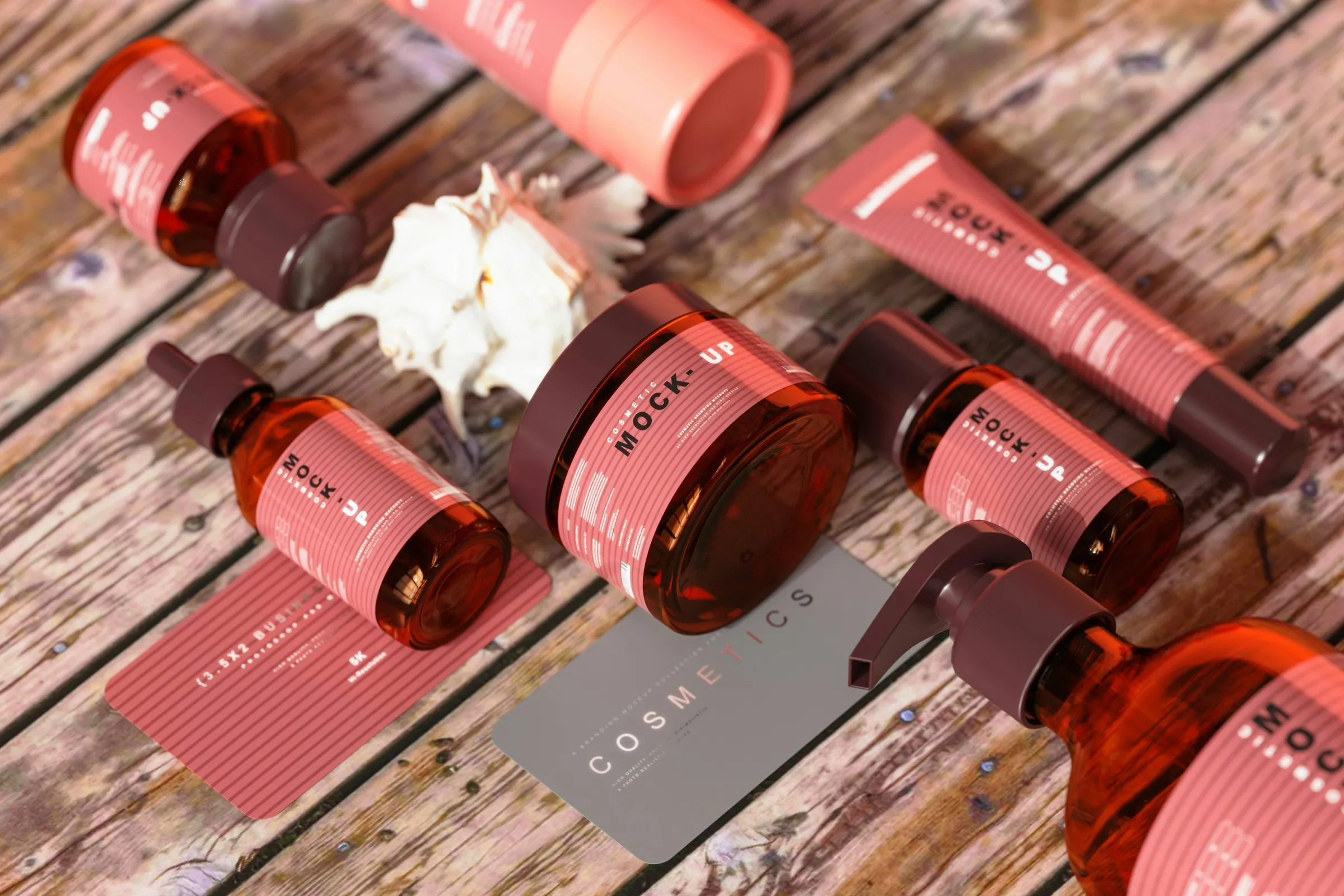 Pink and amber skincare bottles, tube and jar with matching labels on weathered wood
