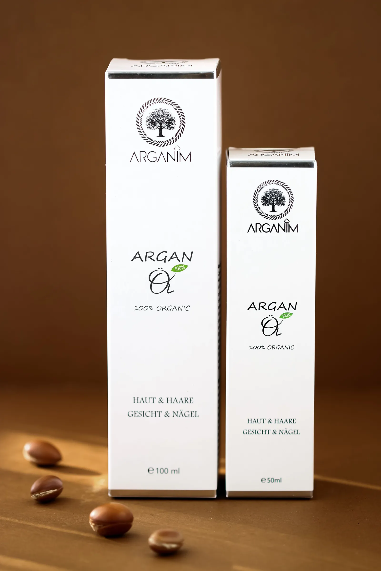 Tall white cartons for argan oil with argan nuts