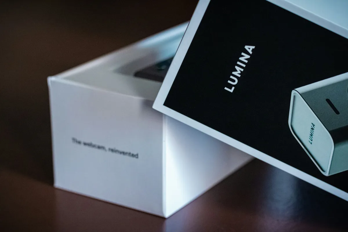 White electronics box with a black printed sleeve and product inside