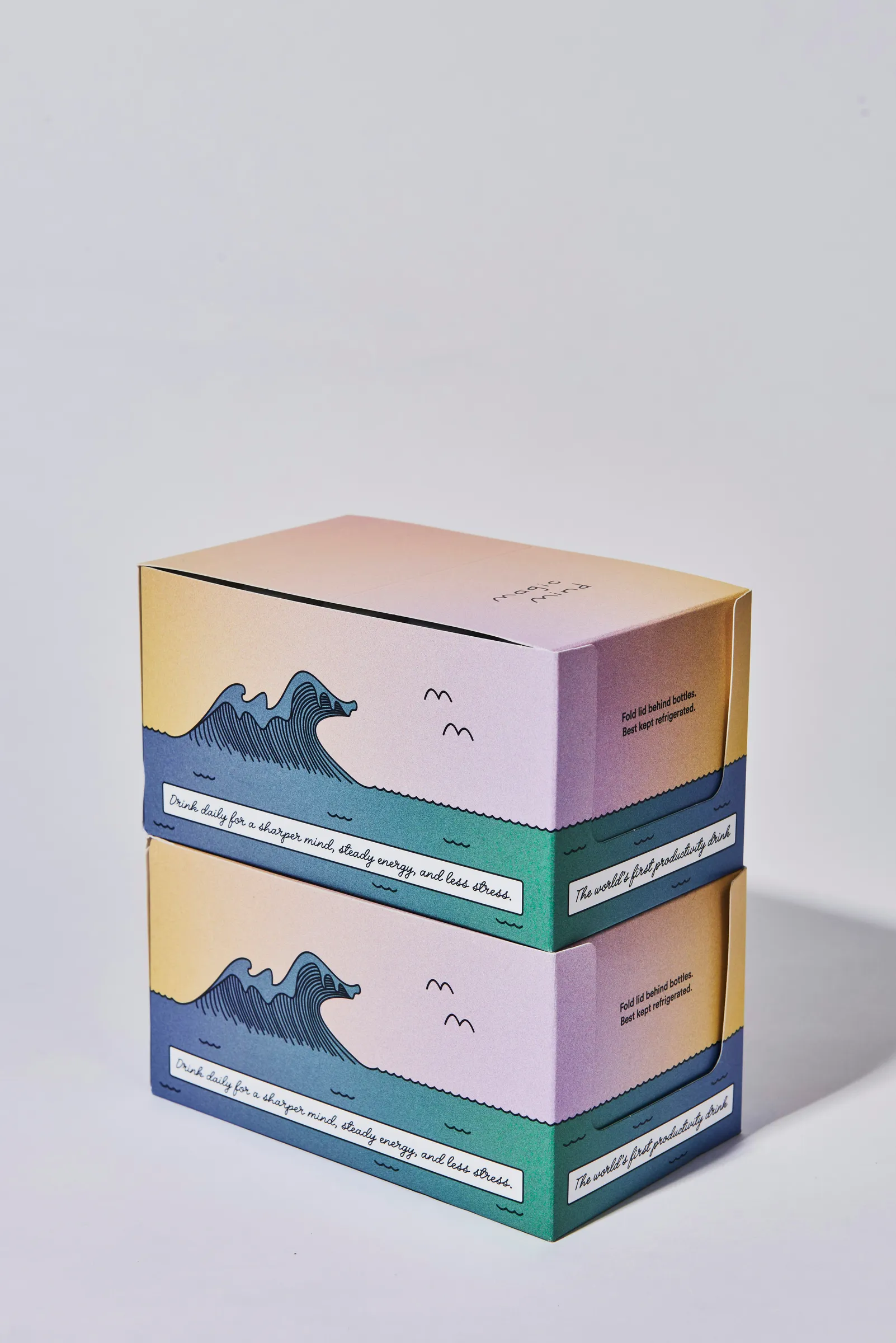 Two stacked folding cartons printed with a wave illustration
